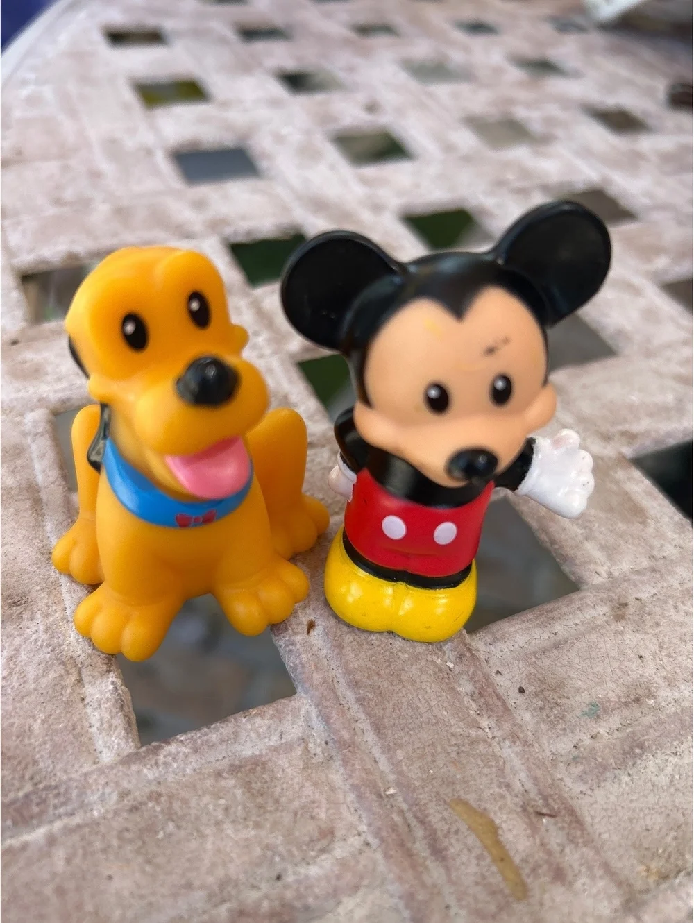 Mickey Mouse and Pluto Fisher face little people